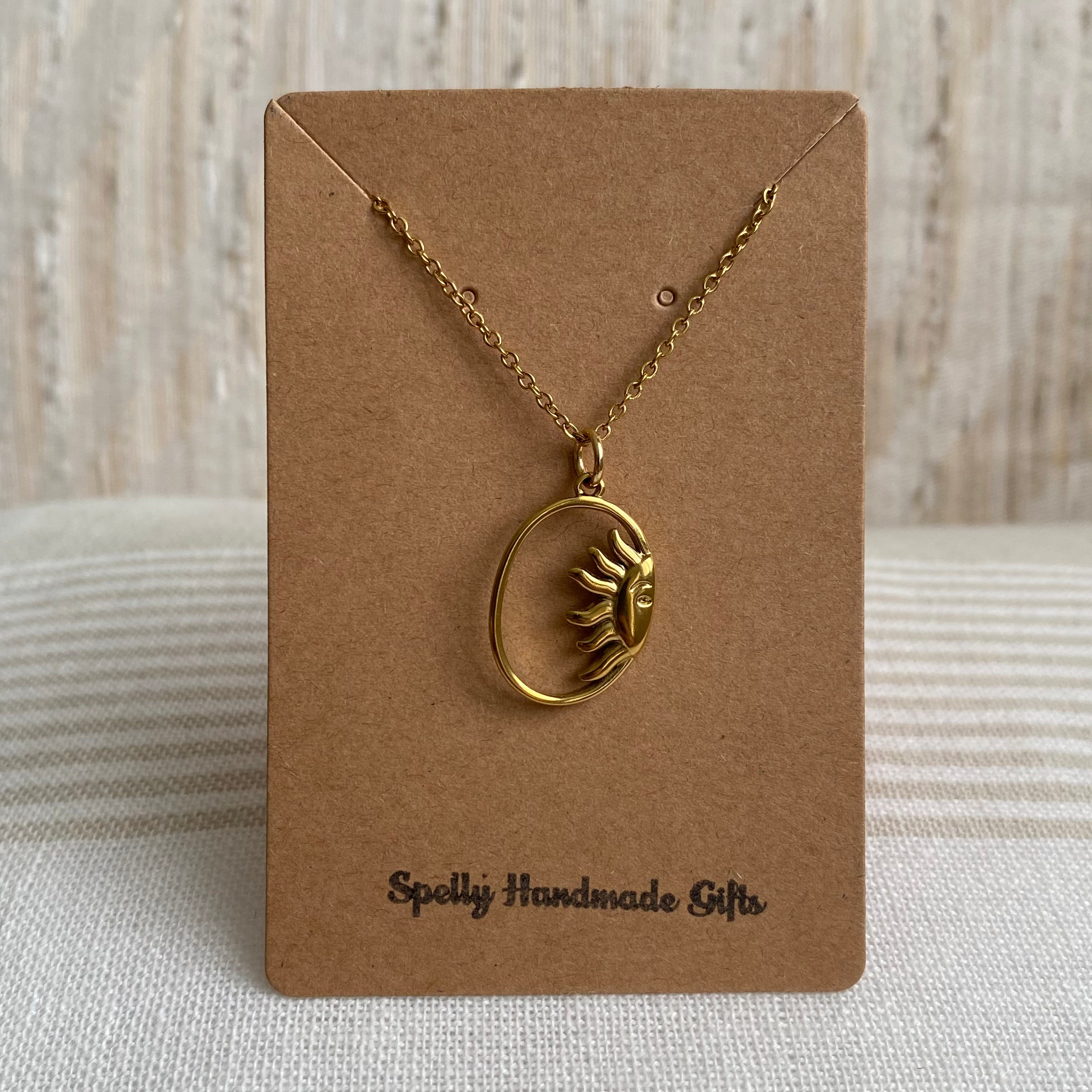 Gold Peaking Sun in Oval Pendant Necklace