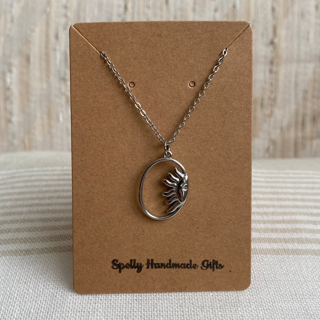 Silver Peaking Sun in Oval Pendant Necklace