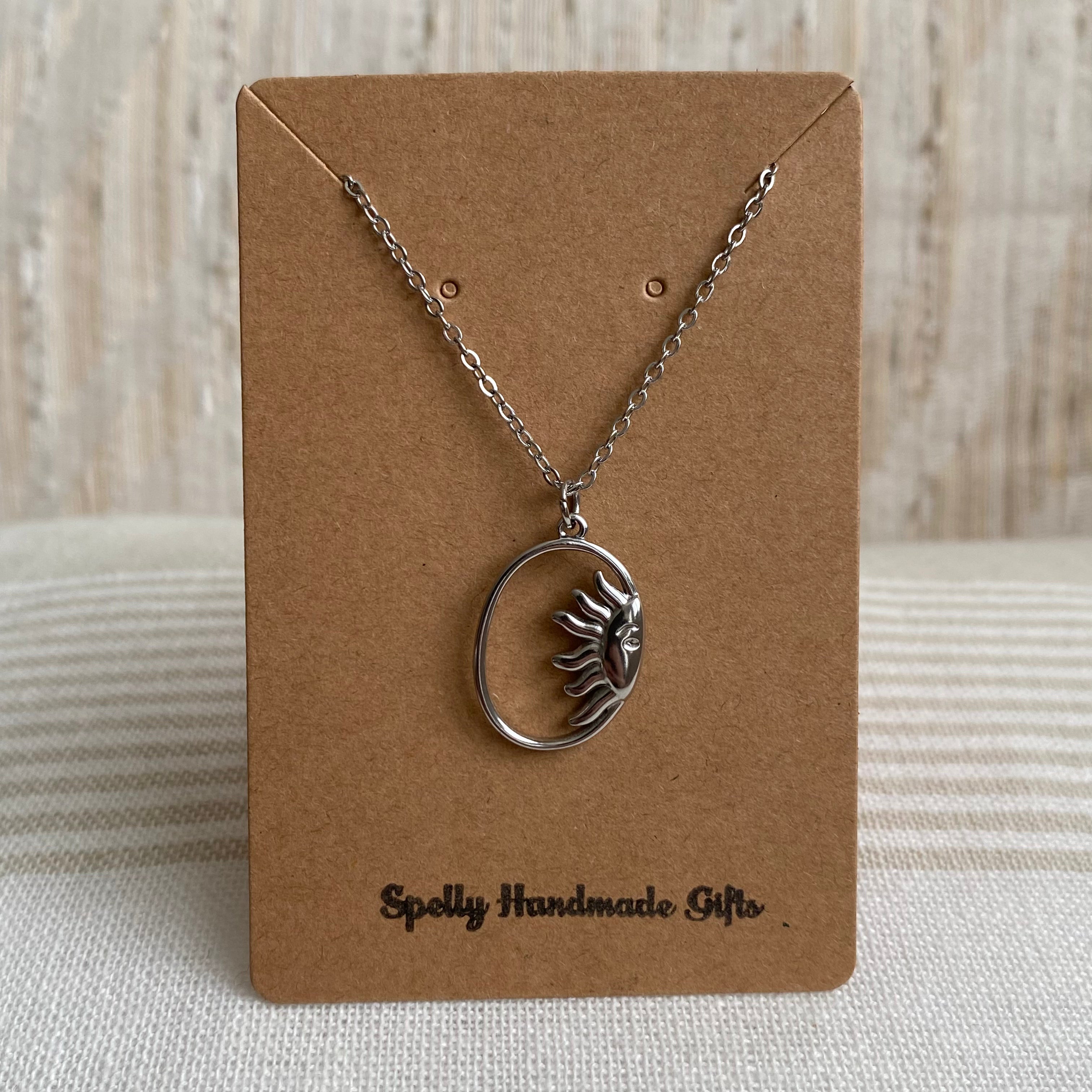 Silver Peaking Sun in Oval Pendant Necklace