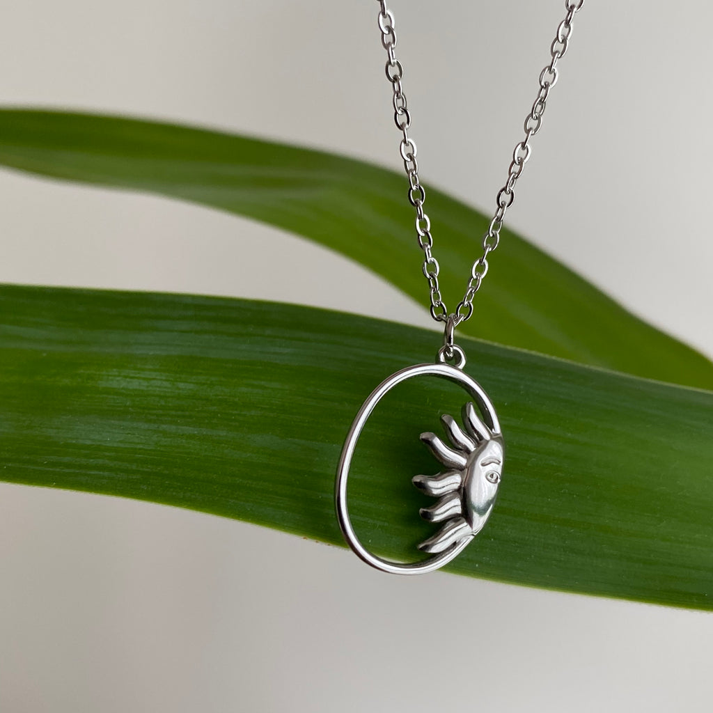 Silver Peaking Sun in Oval Pendant Necklace