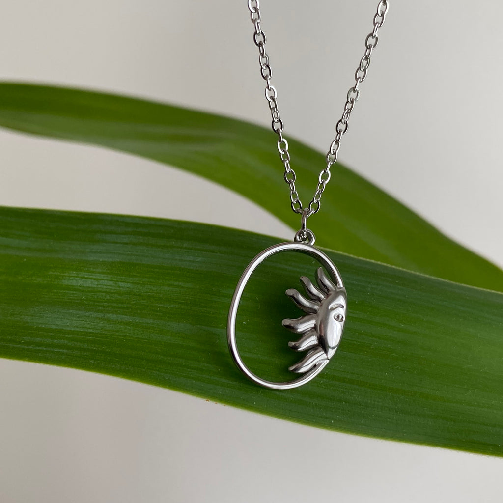 Silver Peaking Sun in Oval Pendant Necklace
