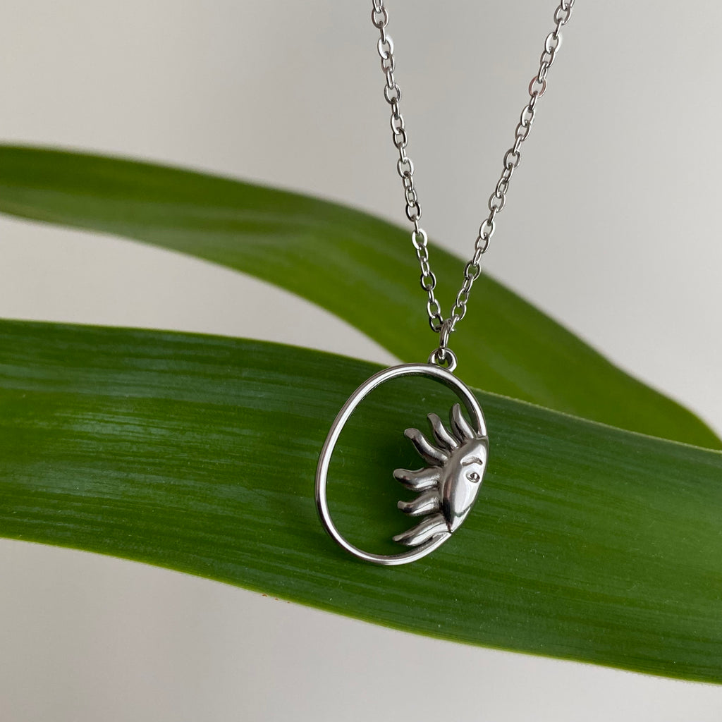 Silver Peaking Sun in Oval Pendant Necklace