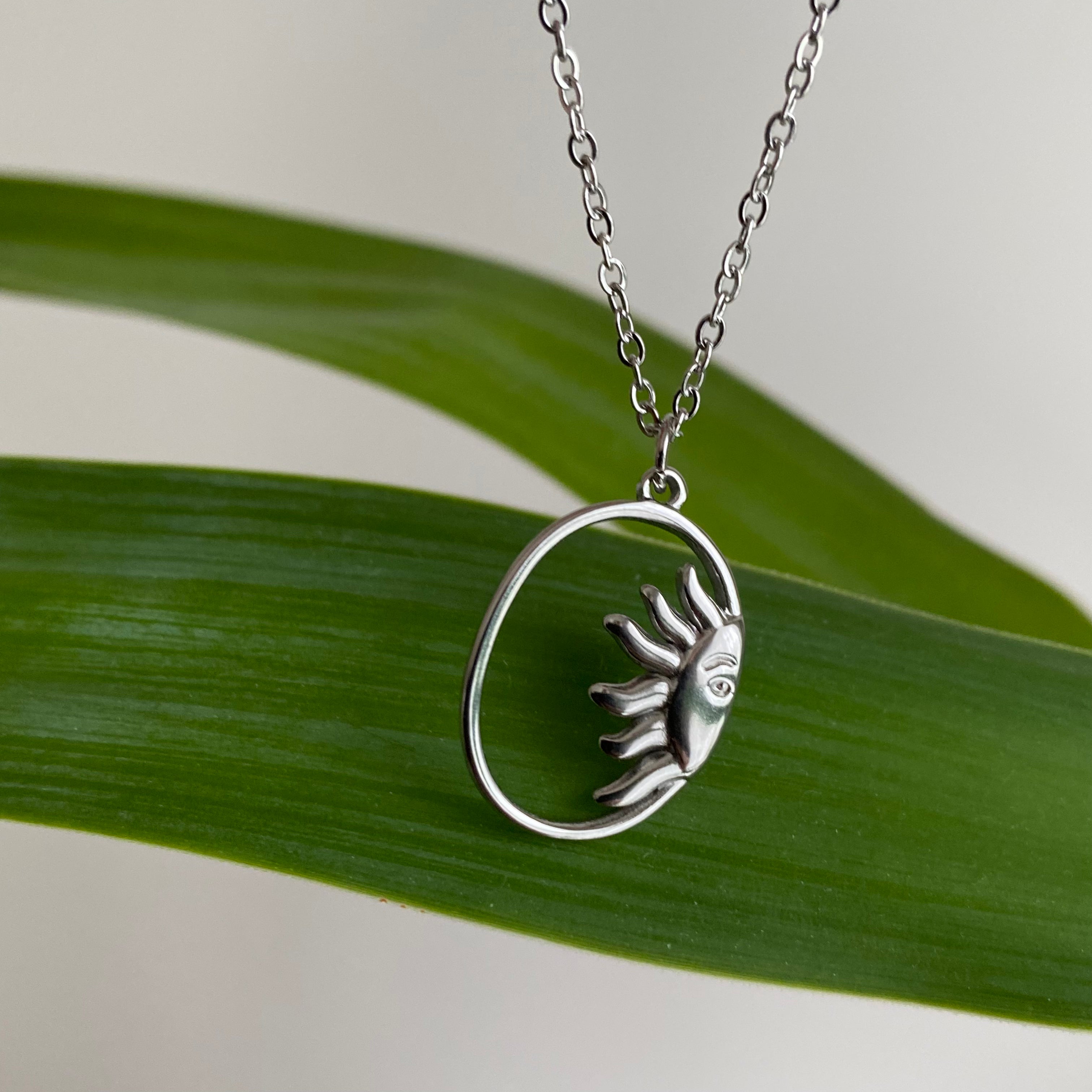 Silver Peaking Sun in Oval Pendant Necklace