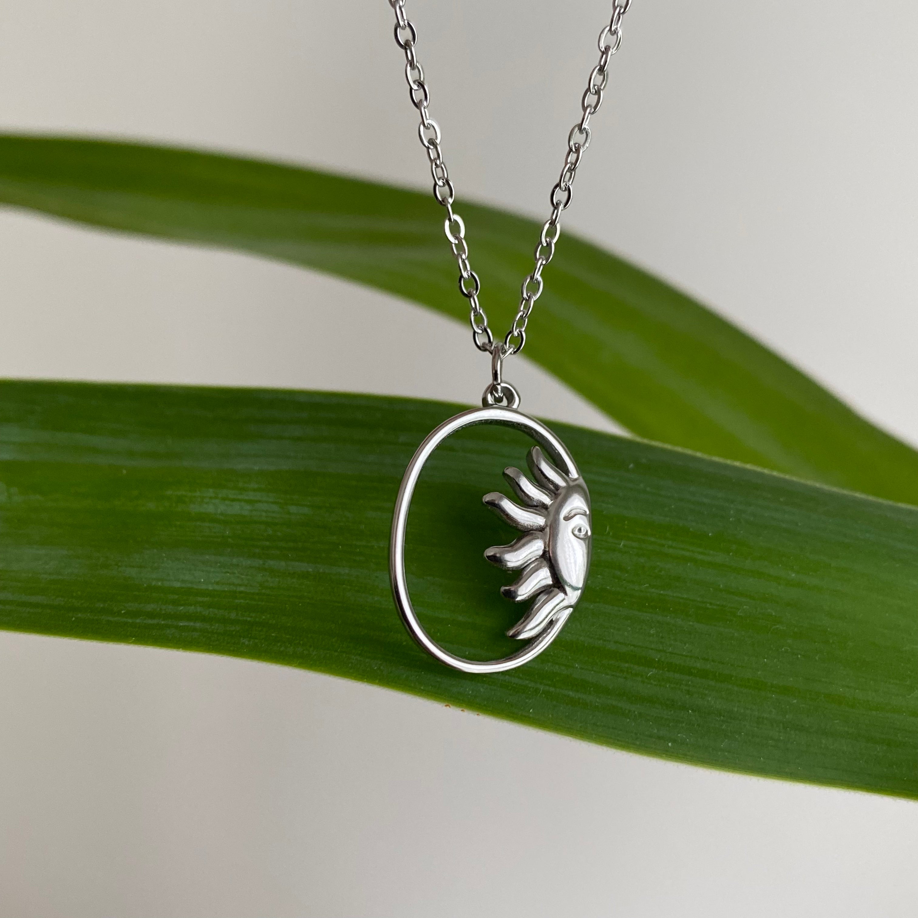 Silver Peaking Sun in Oval Pendant Necklace