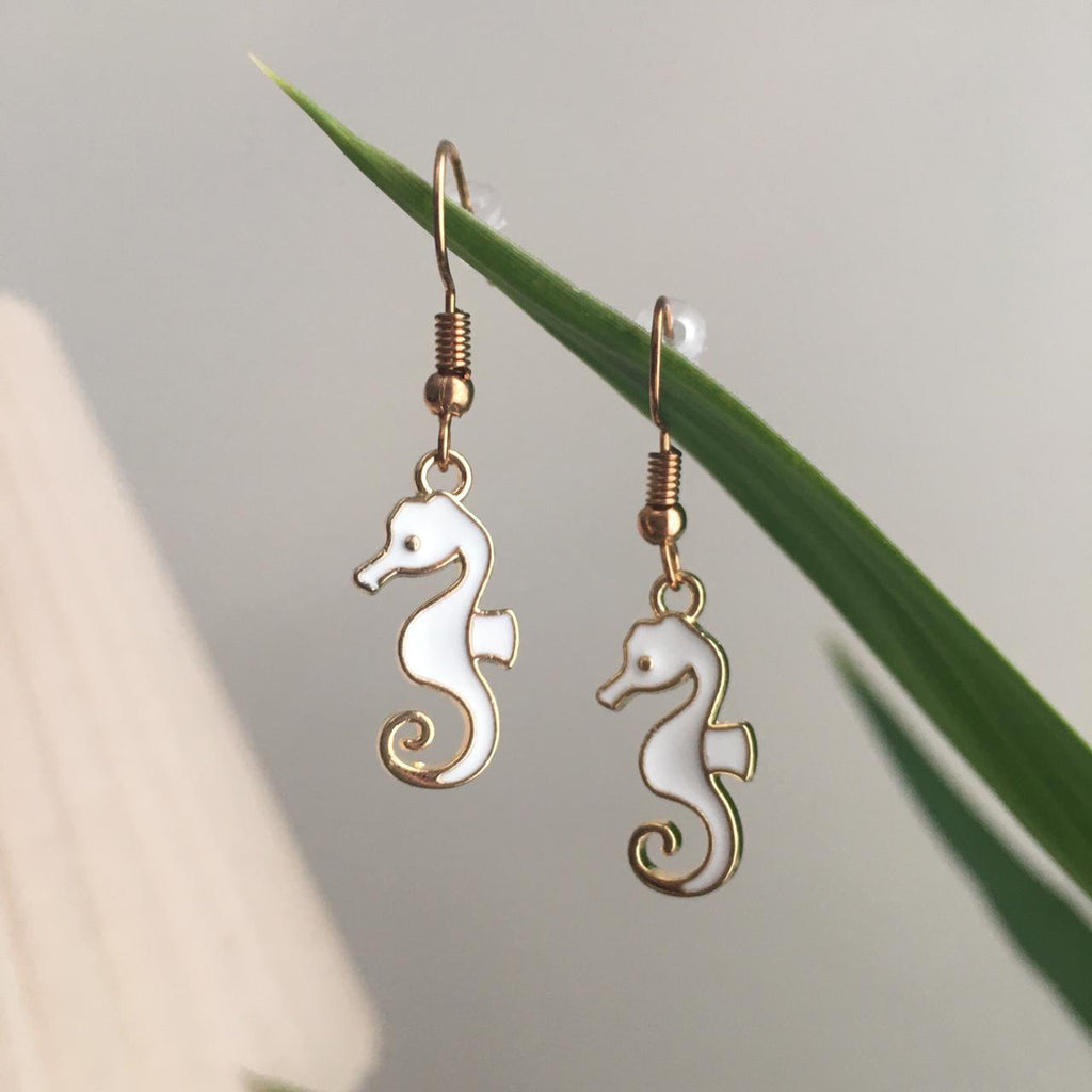 White Seahorse Dangle Earrings With Gold Accents