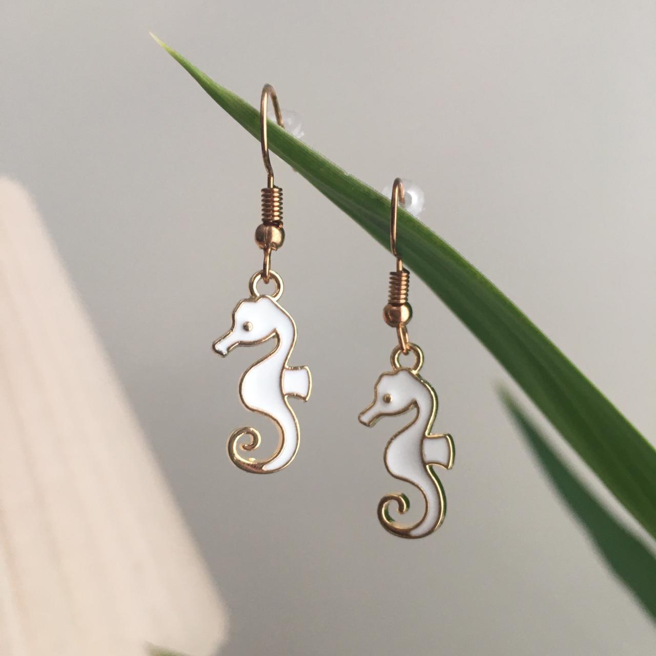White Seahorse Dangle Earrings With Gold Accents