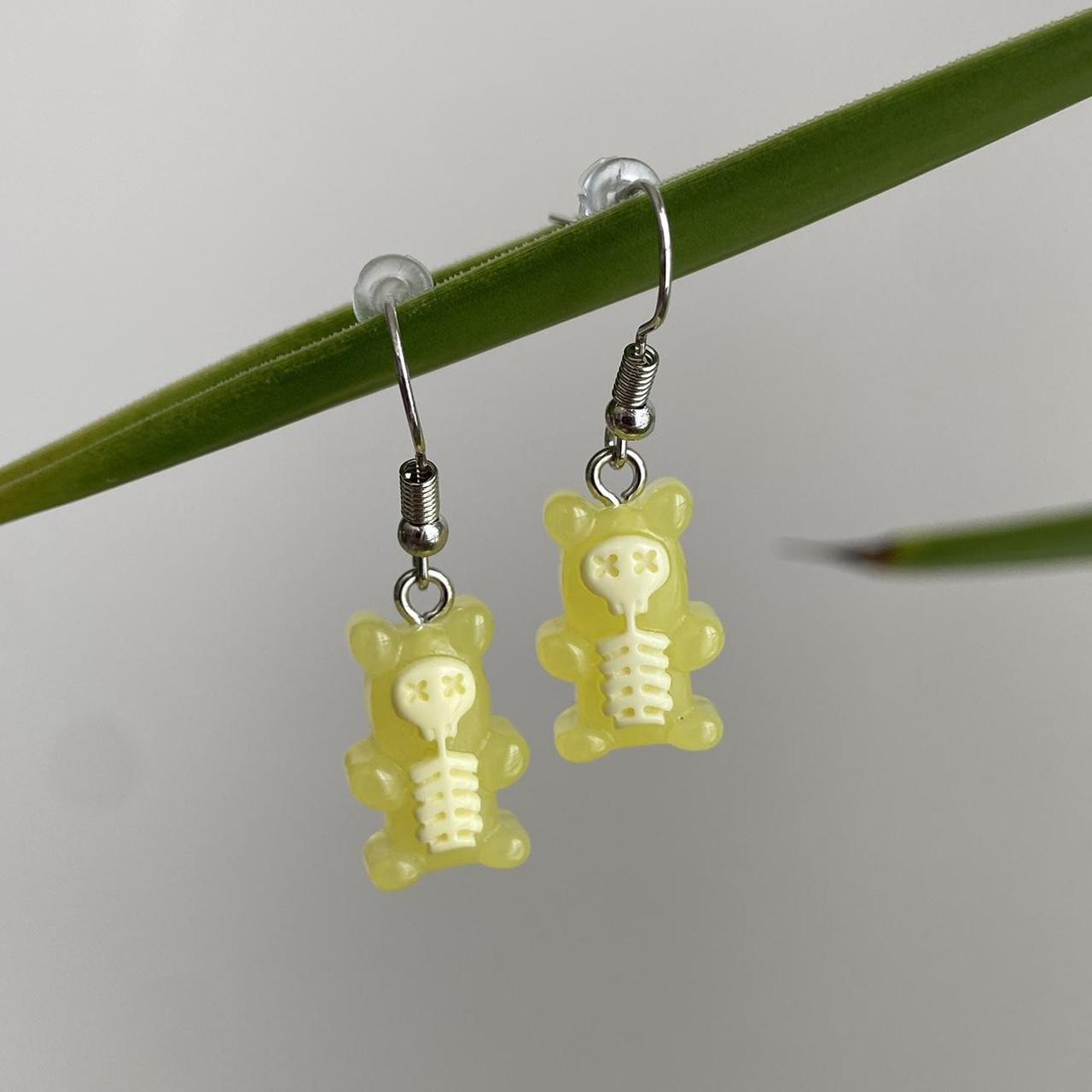 Yellow Skeletal Gummy Bear Dangle Earrings Hand - Image 4