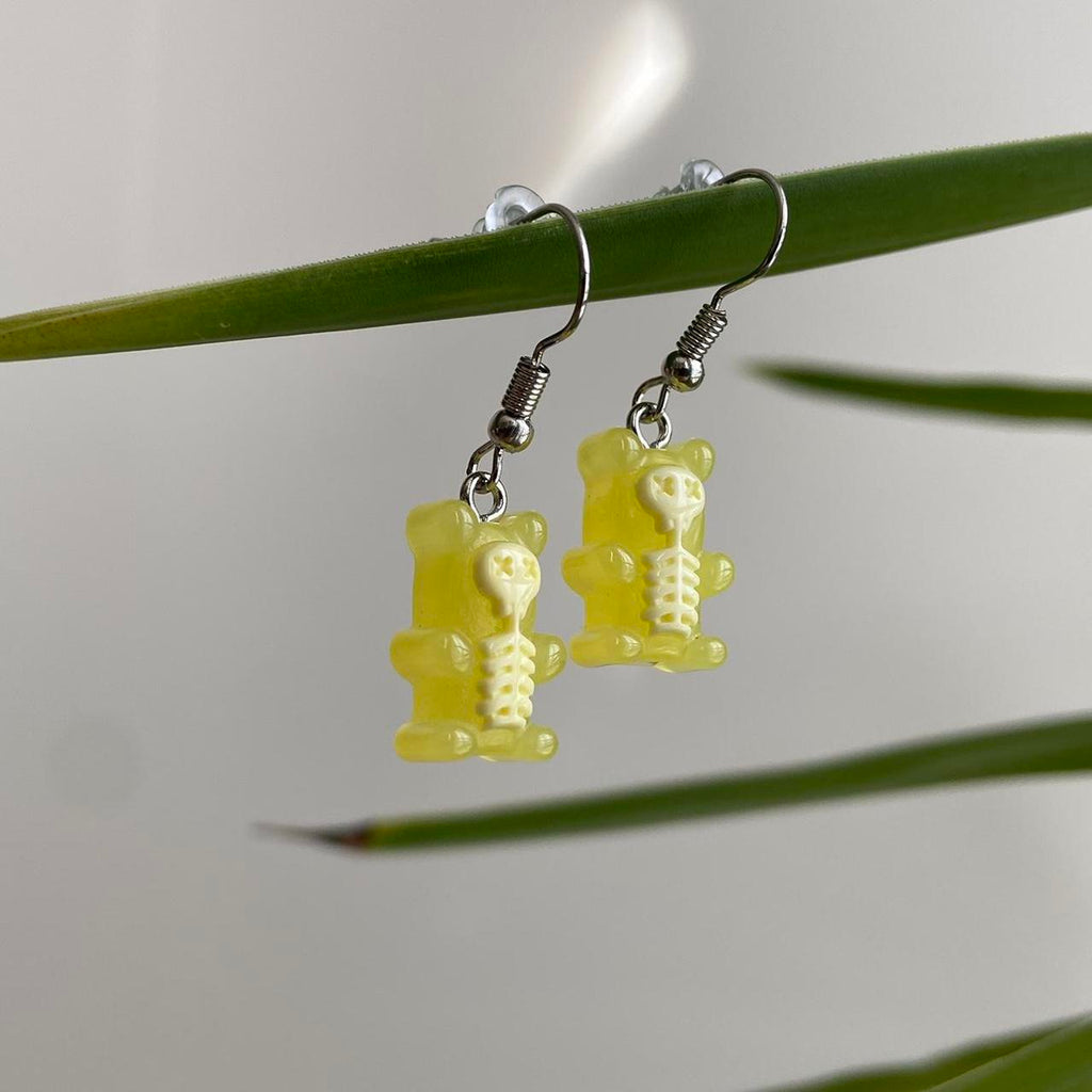 Yellow Skeletal Gummy Bear Dangle Earrings Hand - Image 2