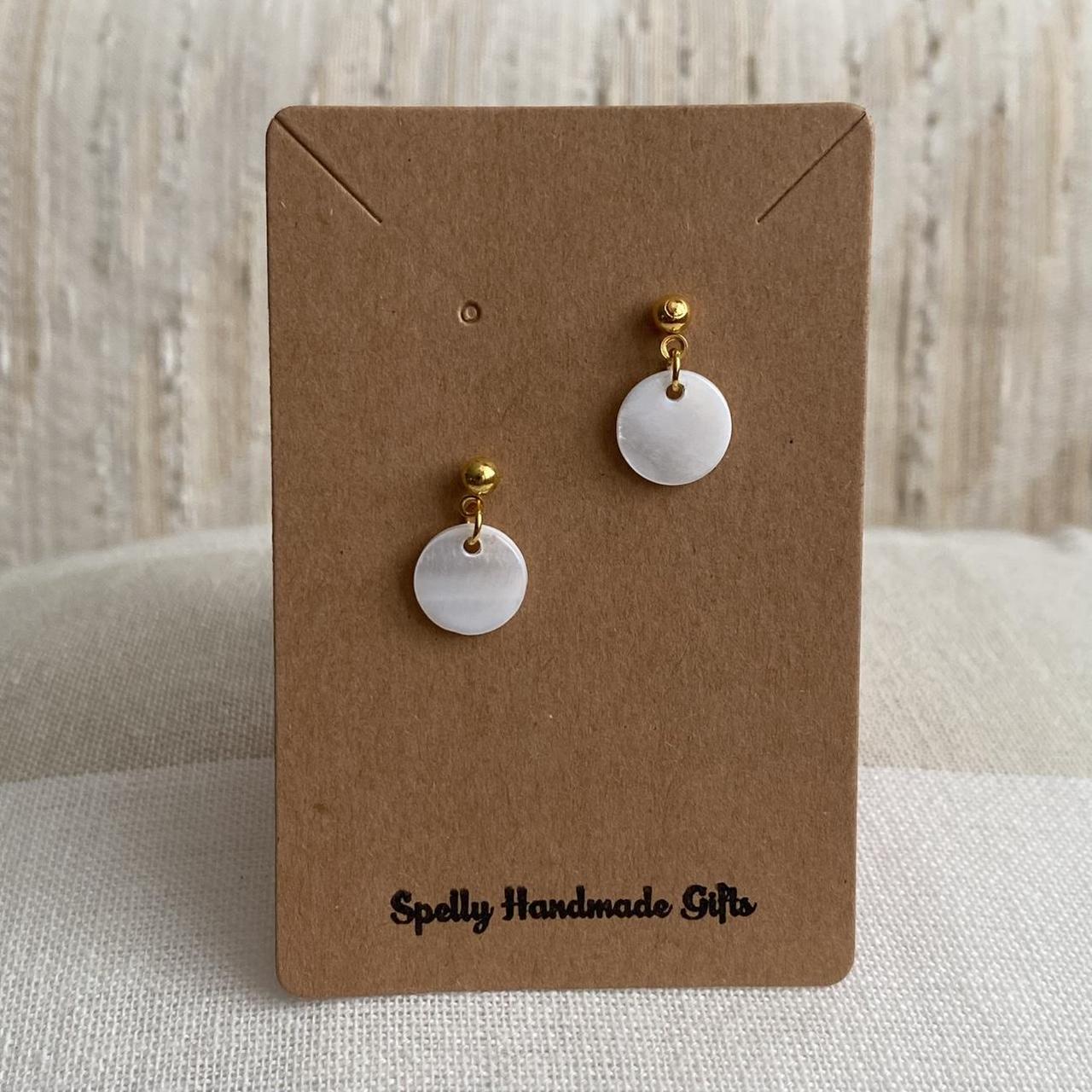 White Circle Shell Gold Dangle Stud Earrings Hand - Image 4