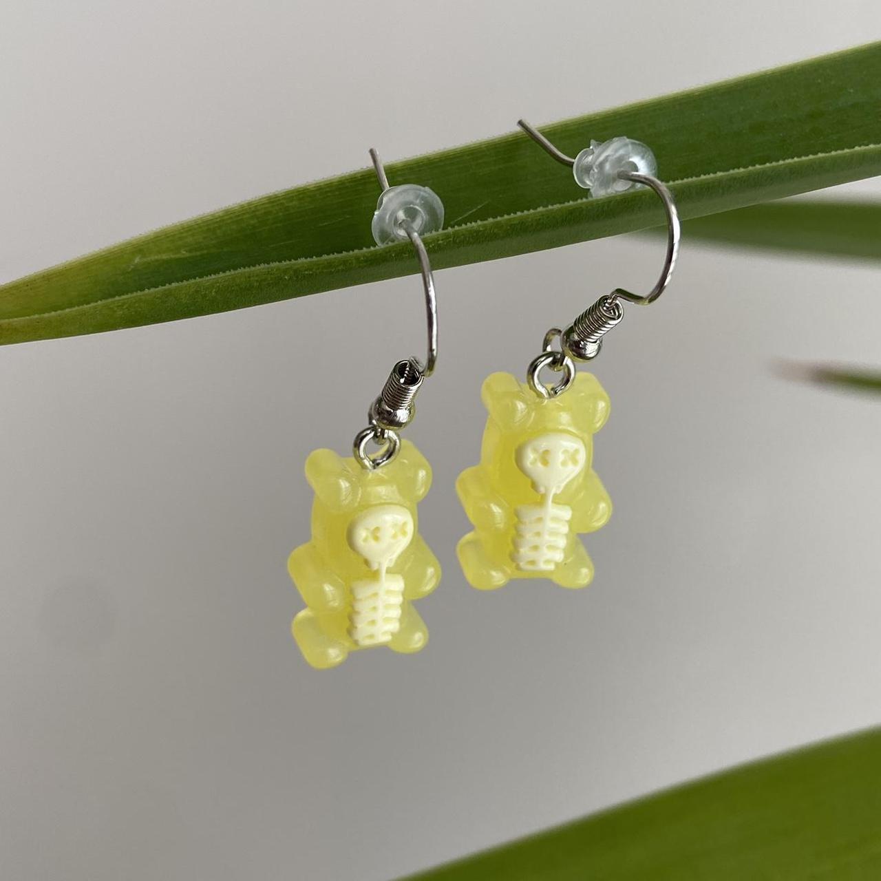 Yellow Skeletal Gummy Bear Dangle Earrings Hand - Image 3