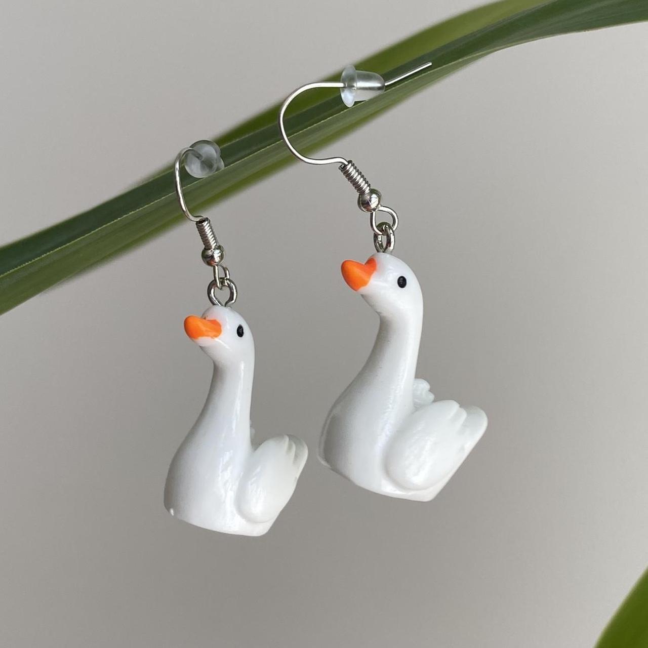 White Goose Dangle Earrings With Silver Accents